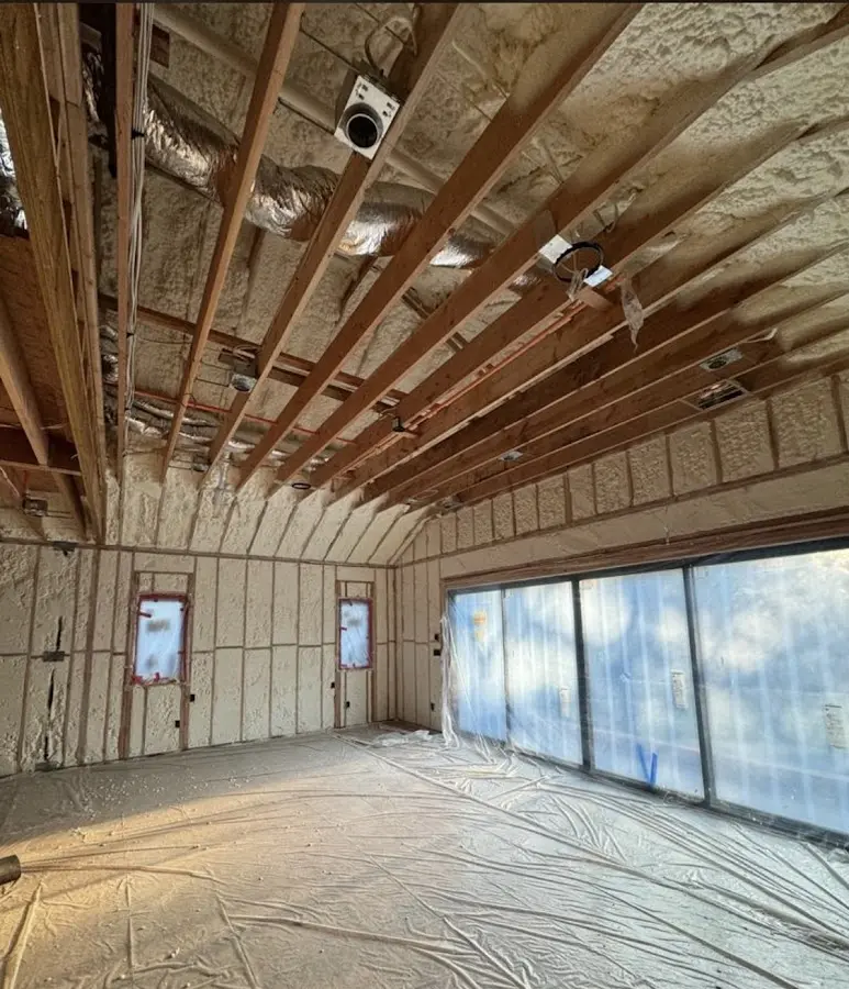 Interior walls and ceiling insulated with spray foam during new construction in Alpharetta